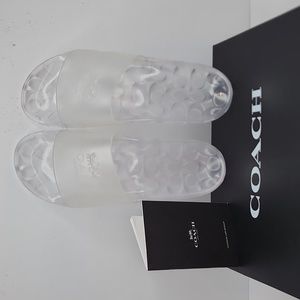 COACH ULYSSA RUBBER SLIDE/SHOES, THE SIZE 11B, THE COLOR IS "CLEAR", 100% RUBBER